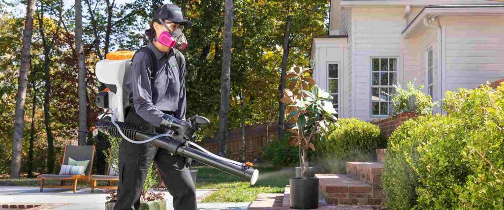 Terminix Employee Spraying for pests